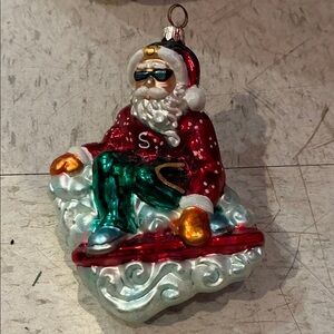 Santa Claus Snowboarding Holiday Ornament with Red and Green Accents